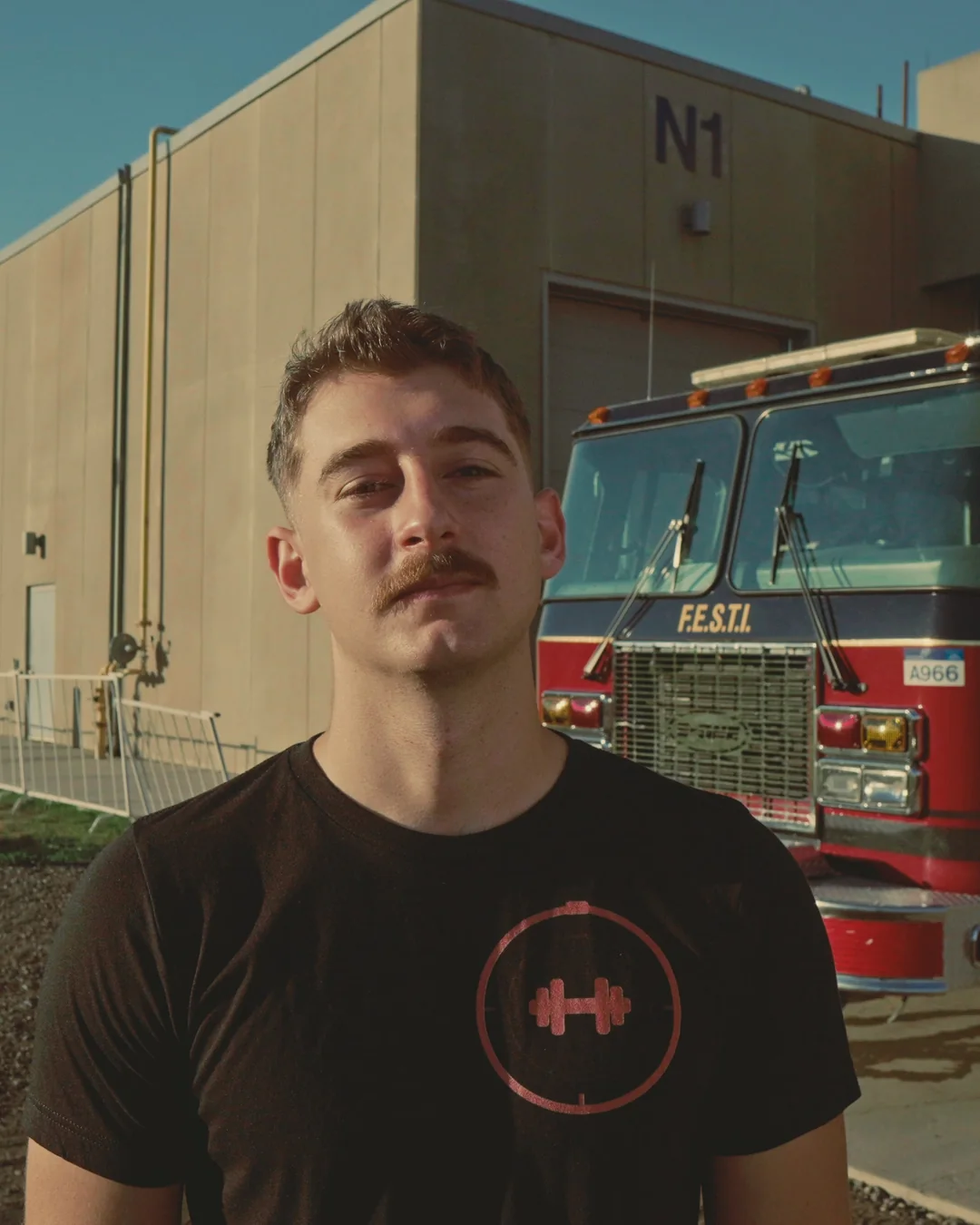 Cole Zon — kinesiologist and FESTI graduate, outside the FESTI fire hall